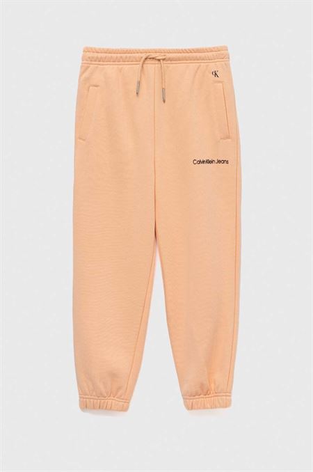 Detské tepláky Calvin Klein Jeans oranžová farba