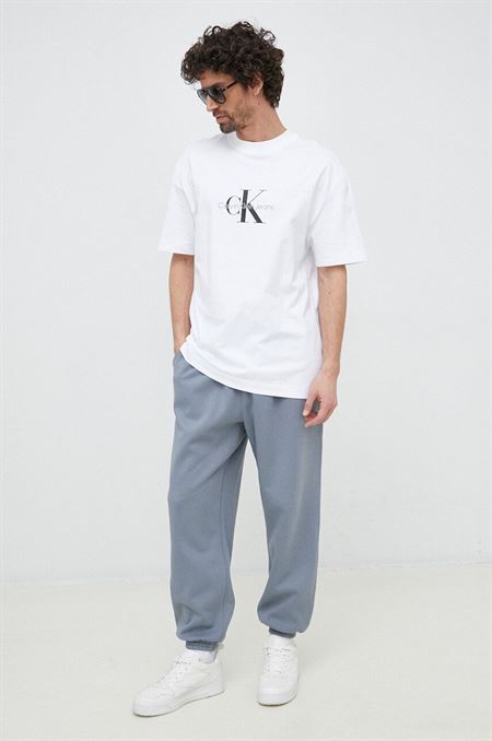 Tepláky Calvin Klein Jeans šedá farba